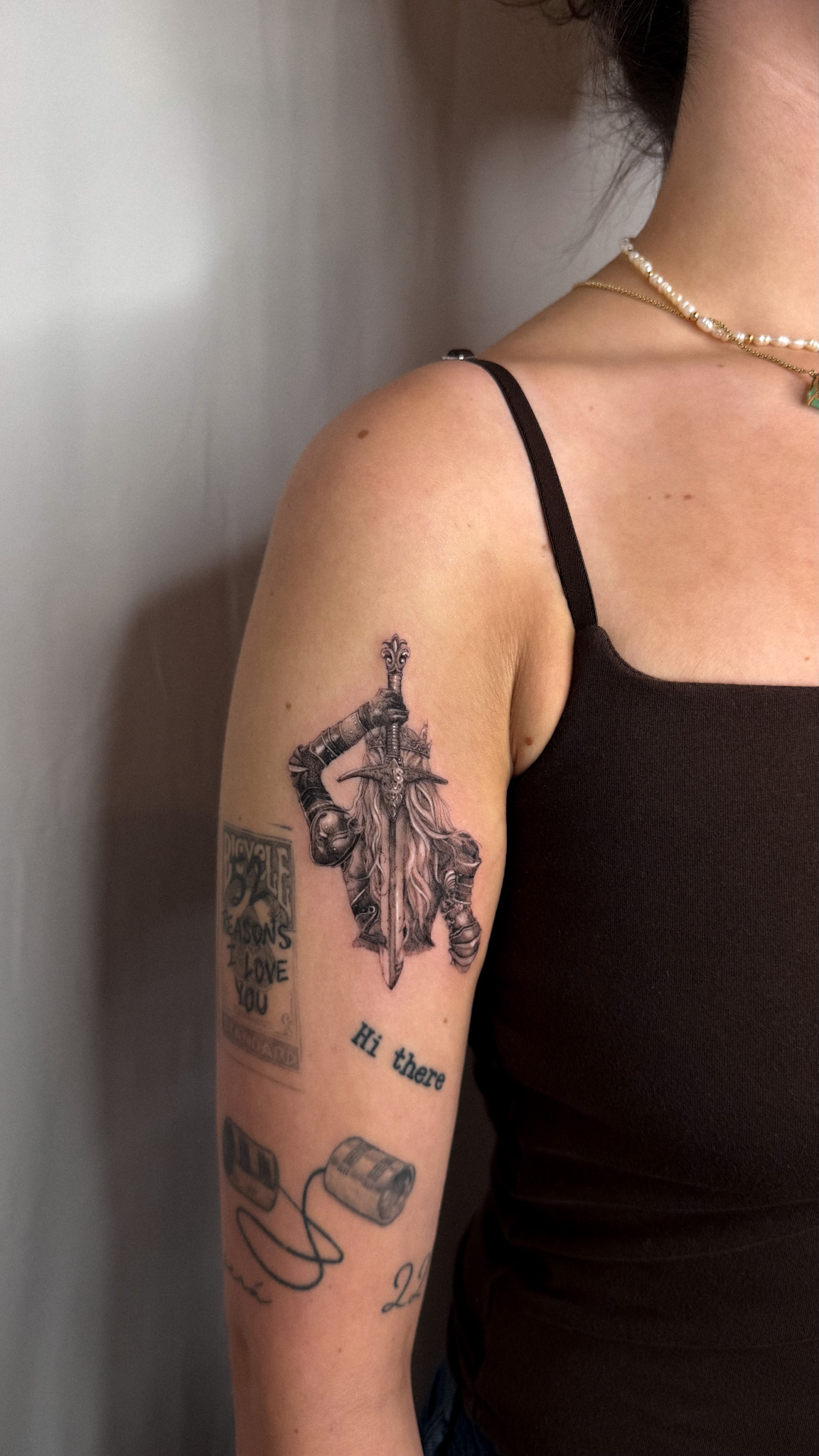 Fine-line tattoo placement on the forearm